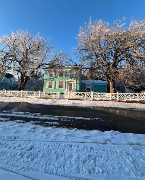 Iced trees frame a house on Mackinac Island.