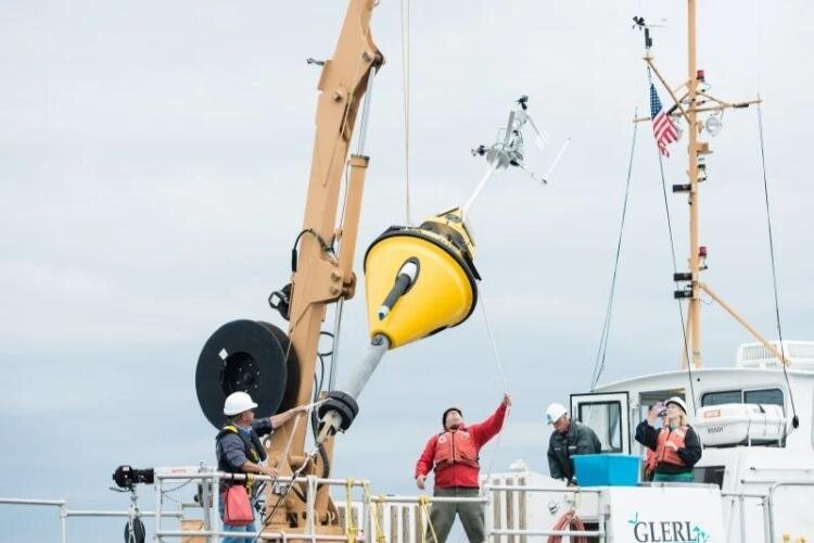 Researchers deploy data-collecting buoy on Lake Superior.
