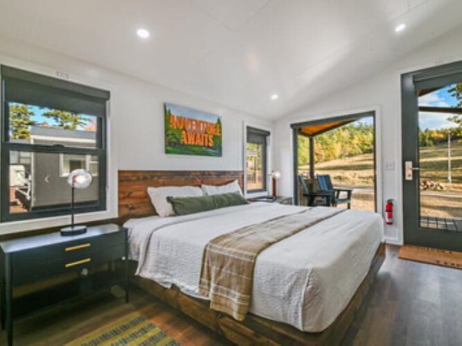 The bedroom in one of the new cabins. At some cabins, skiers can ski out the door to the lifts.