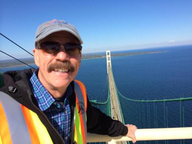 Adventurous Tom Daldin gets a close-up view of the Mackinac Bridge.