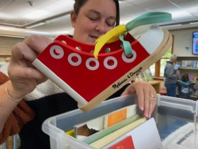 Andrea Estelle, Otsego District Library director, shows some of the items available to patrons.