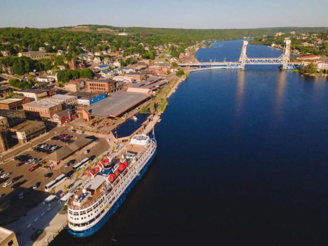 A cruise ship docks at Houghton's transformed waterfront.