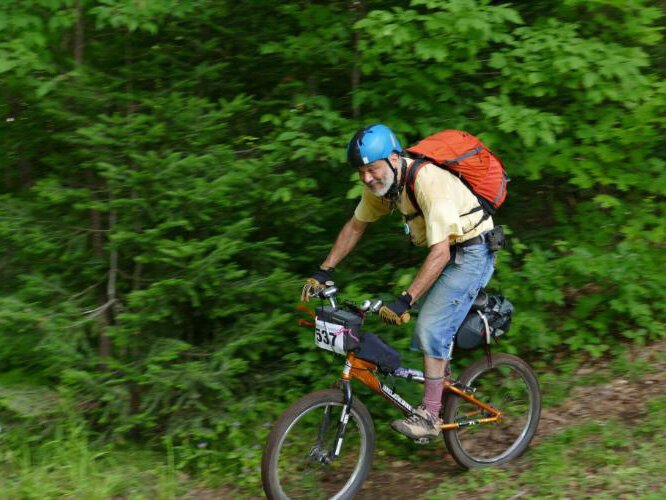 Kiko Silvelet rides his BMX bike 'Glamour Girl' during Miners Revenge – a mountain bike race in the Upper Peninsula.