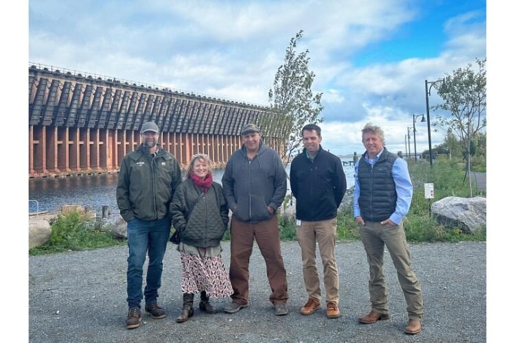 Marquette city staff meet with artist Jason Quigno at site of his future sculpture installation.