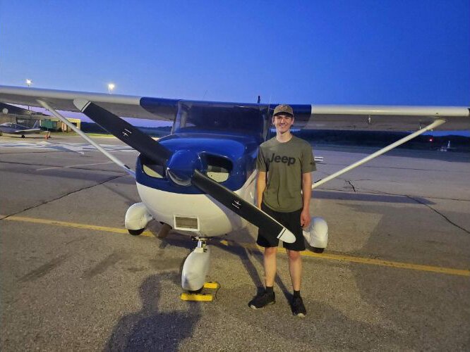 Nathan O'Brion, a graduate of the aviation program, poses after a check ride to become a certified pilot.