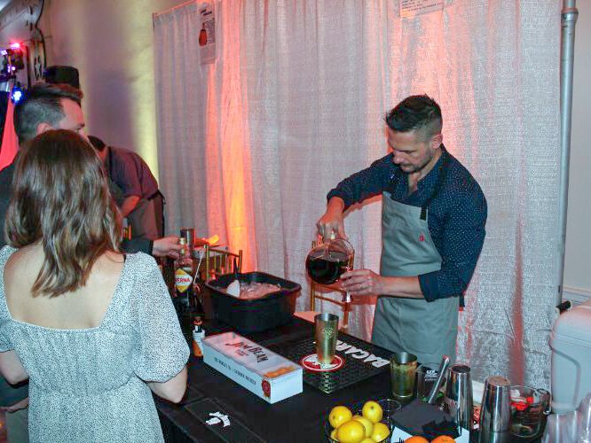 Livio Stabile of The Landmark Inn pours part of his "sweet" drink, a digestive amaro based cocktail.