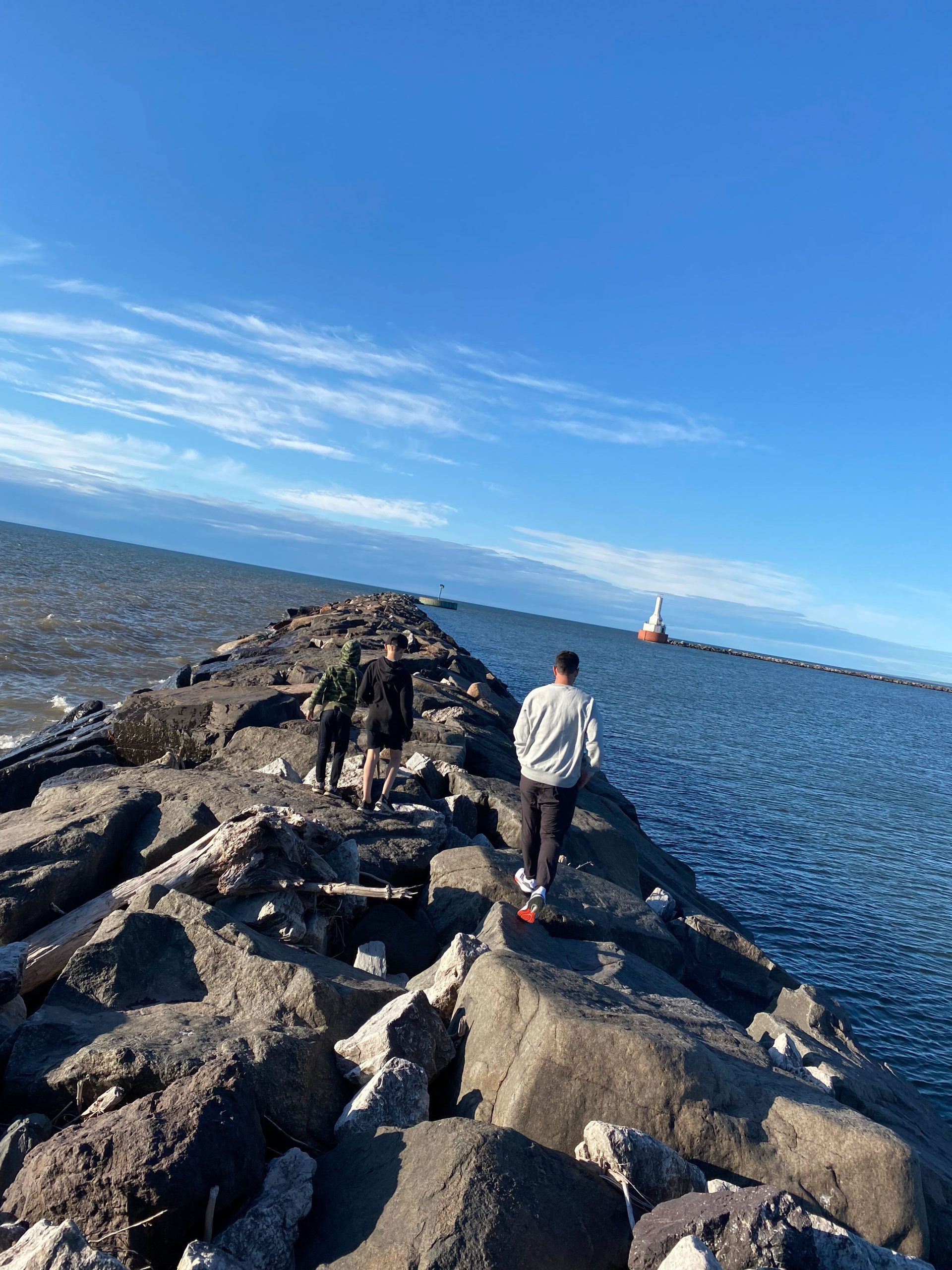 Ian Repp hiking with his older boys, Cale, 13, and Crosby, 9, at the north entry of the Keweenaw Waterway.