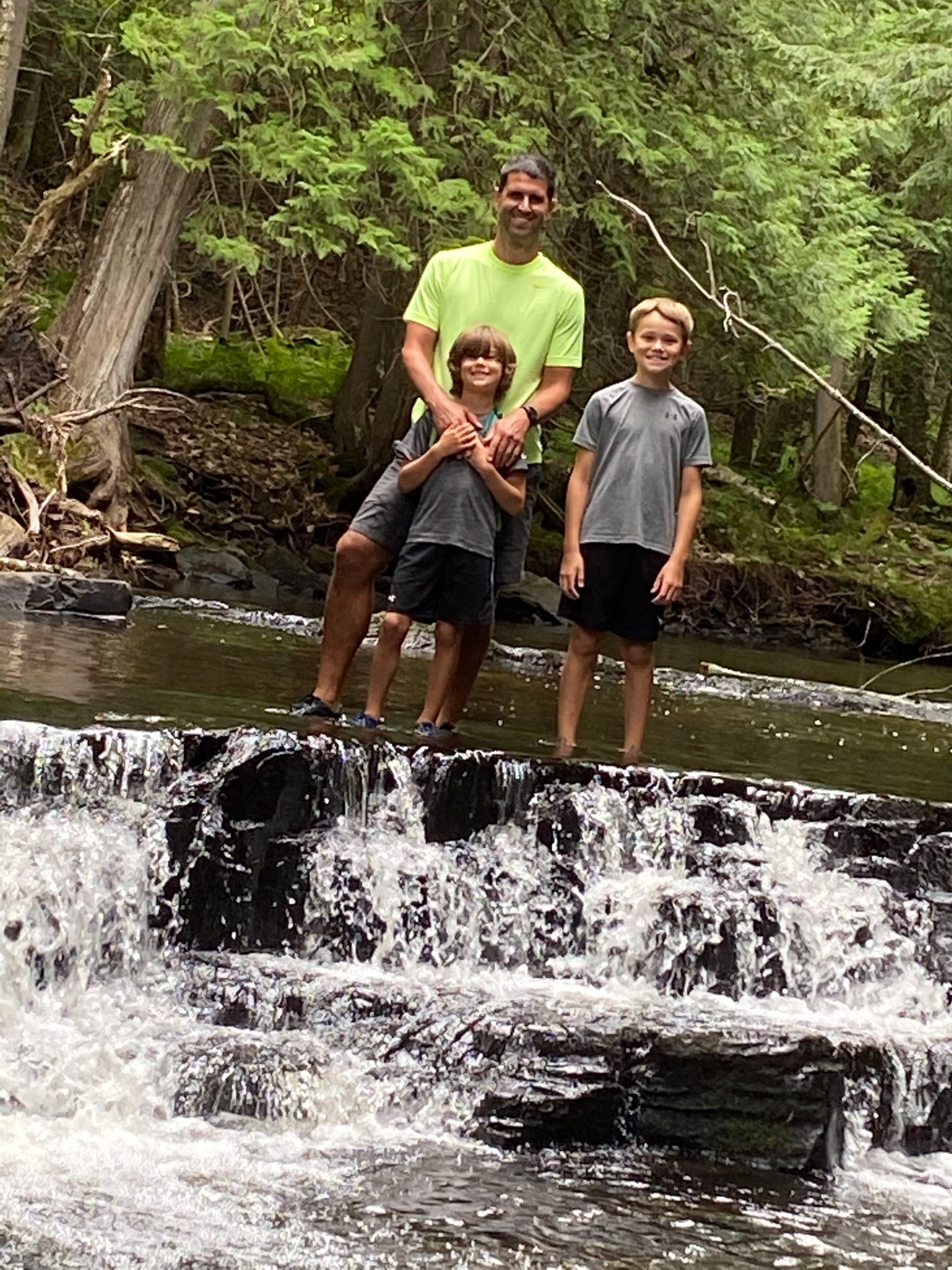 Ian Repp hiking the Slate River Falls with his older sons.