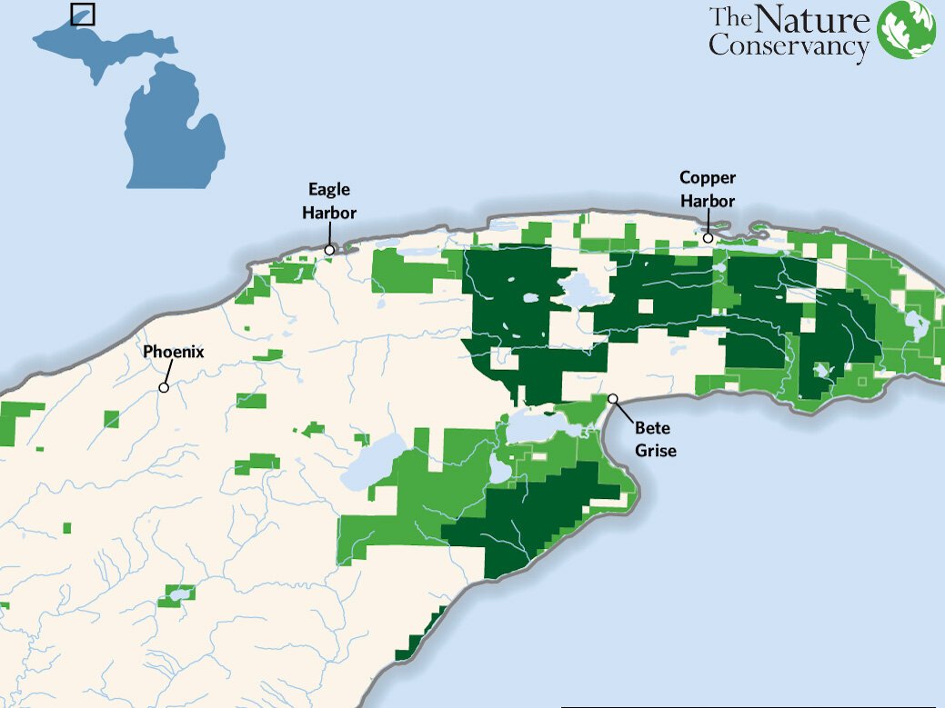 The dark green shows newly protected land; the light green shows existing protected land.