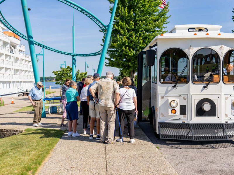 Passengers board a trolley to take a tour of Muskegon.