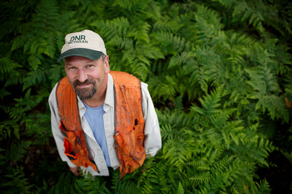 Bill Sterrett stands in a portion of maintained state forest land.  It was clear cut around 35 years ago and has grown back.