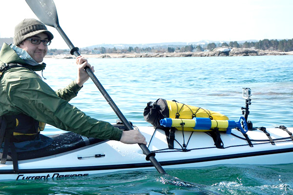 Clear & Cold Cinema founder Aaron Peterson films sea kayaking on Lake Superior near Marquette