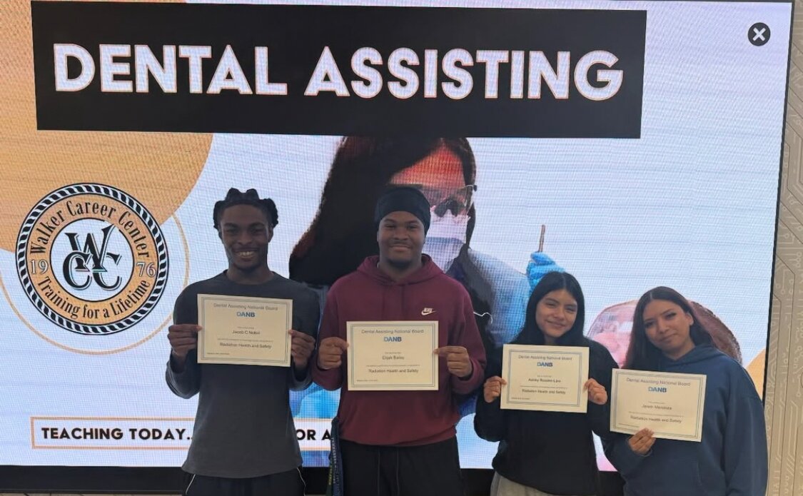 Walker Career Center students proudly display their dental assisting certifications.