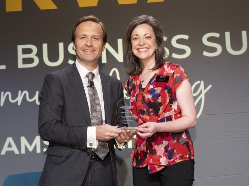 SBAM President and CEO Brian Calley (left) presents the Small Business Association of Michigan 2024 Advocate Award to Stormy Kromer CEO Gina Thorsen at the SBAM annual meeting on June 13 in Lansing.