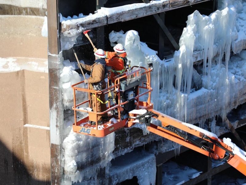 Winter maintenance crews at the Soo Locks in Sault Ste. Marie, Michigan work on chipping ice from the Poe Lock miter gate and using steam lines to melt the ice. This is needed so the gates can fully close.